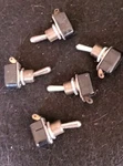 Five Carling Spst Toggle Switches, Long Bat Handle - See Description New. Price: $15.00.