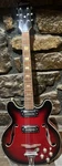 Univox Coily Hollow Body Electric Guitar, 2 Pickups, Red Starburst-new Strings Used. Price: $350.00.