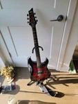 Schecter Guitar Research DEMON-6 Electric Crimson Red Burst Used. Price: $185.00.